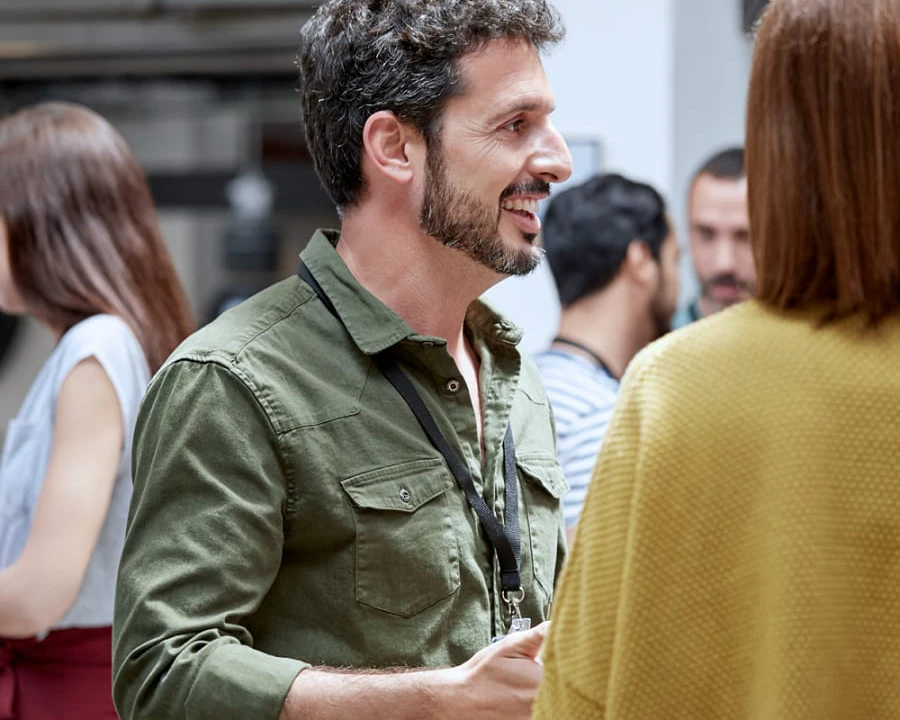 Some talking to people with smile.
