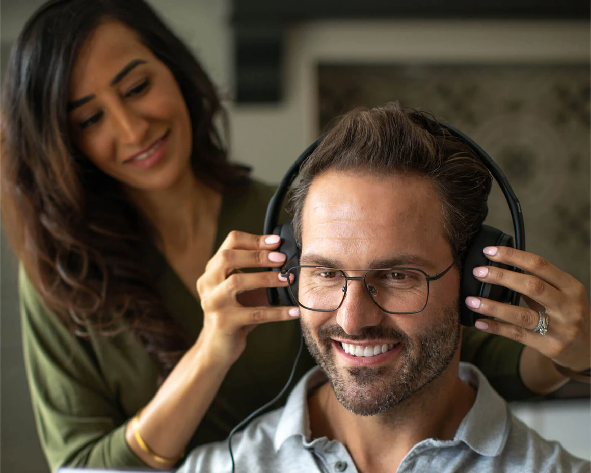 An audiologist performing a hearing assessment on a patient.