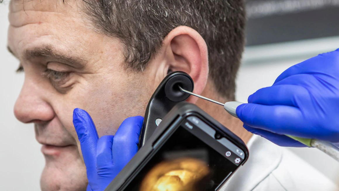 A patient having ear wax removal appointment.